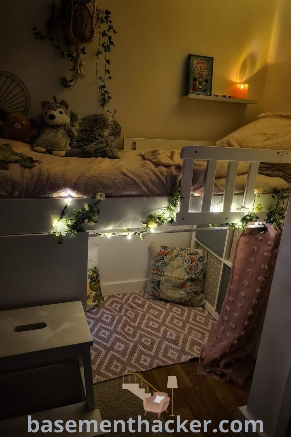 A cozy bunk bed with a stylish under bed chill area that serves as a hideout, showcasing innovative ideas for designing a functional room. This setup includes storage cubes for organization, making it a perfect example of the best basement remodeling ideas for a stylish and organized home, showcasing various options for creative space utilization. Find more inspiration at basementhacker.com.