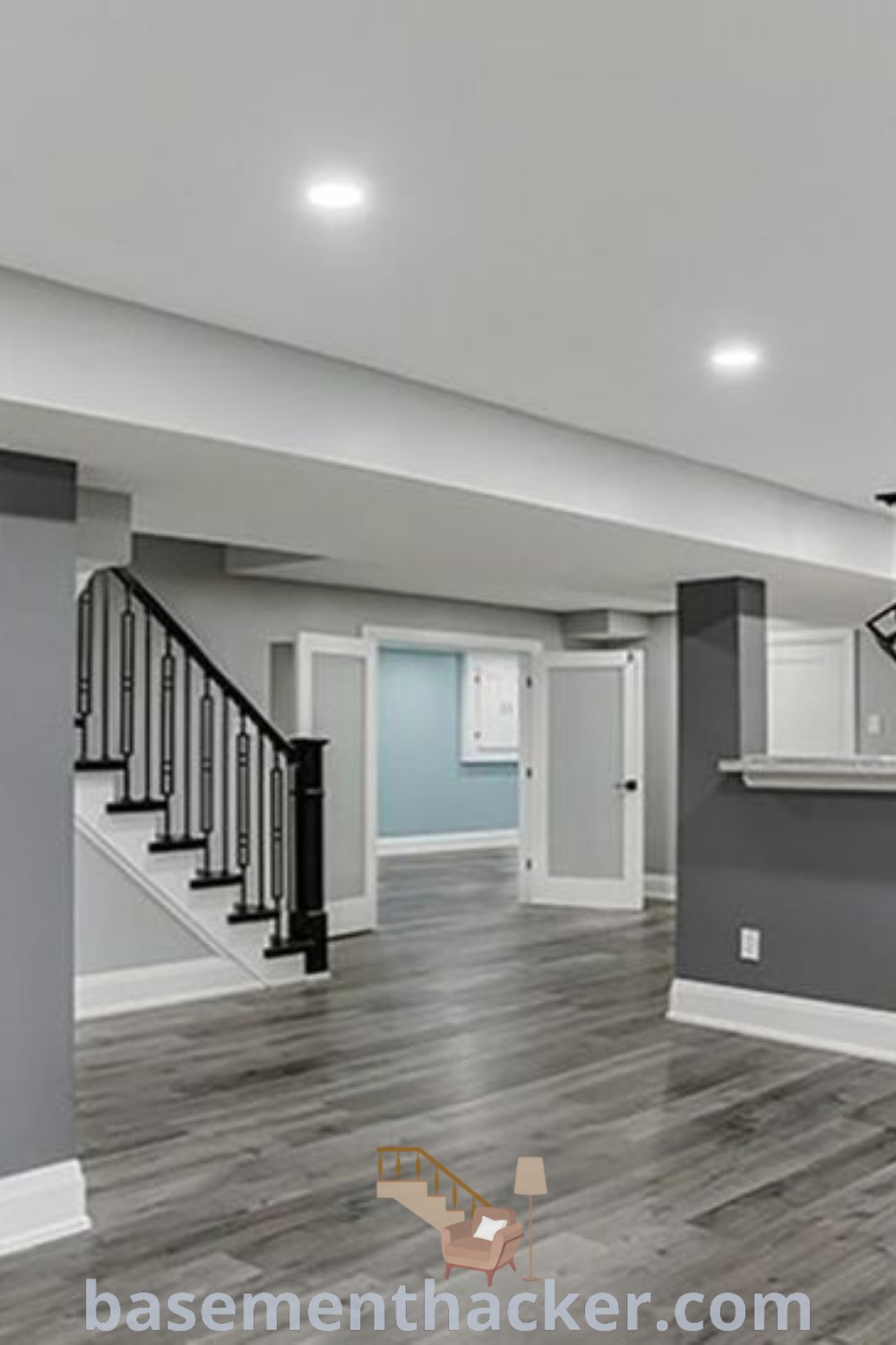 An empty kitchen and living room in a house, showcasing potential for basement makeovers with innovative ideas, wall color concepts, and stylish decor that enhance functionality and aesthetics. For unique basement inspiration, visit basementhacker.com.