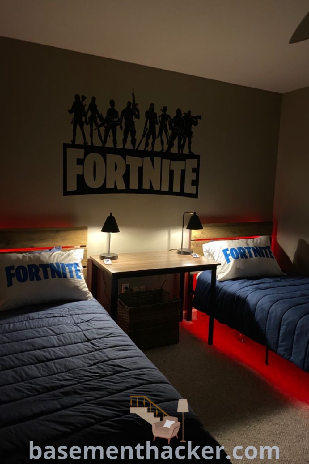A stylish bedroom with two beds featuring vibrant Fortnite decor, illuminated by warm lights and a Fortnite sign on the wall. This room showcases innovative ideas for boys