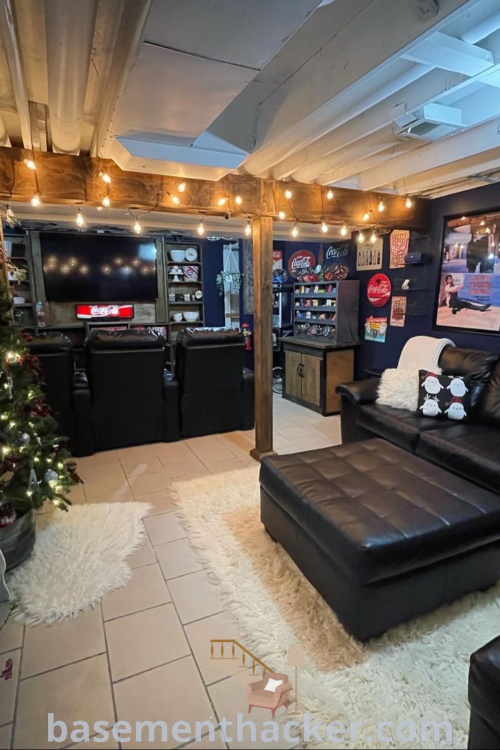 A living room with black furniture and hanging Christmas lights, showcasing innovative basement makeover ideas for a stylish and functional hangout spot. This cozy scene illustrates awesome decor concepts for basement teenage hangouts, ideal for ultimate entertaining and family enjoyment. Explore more at basementhacker.com.