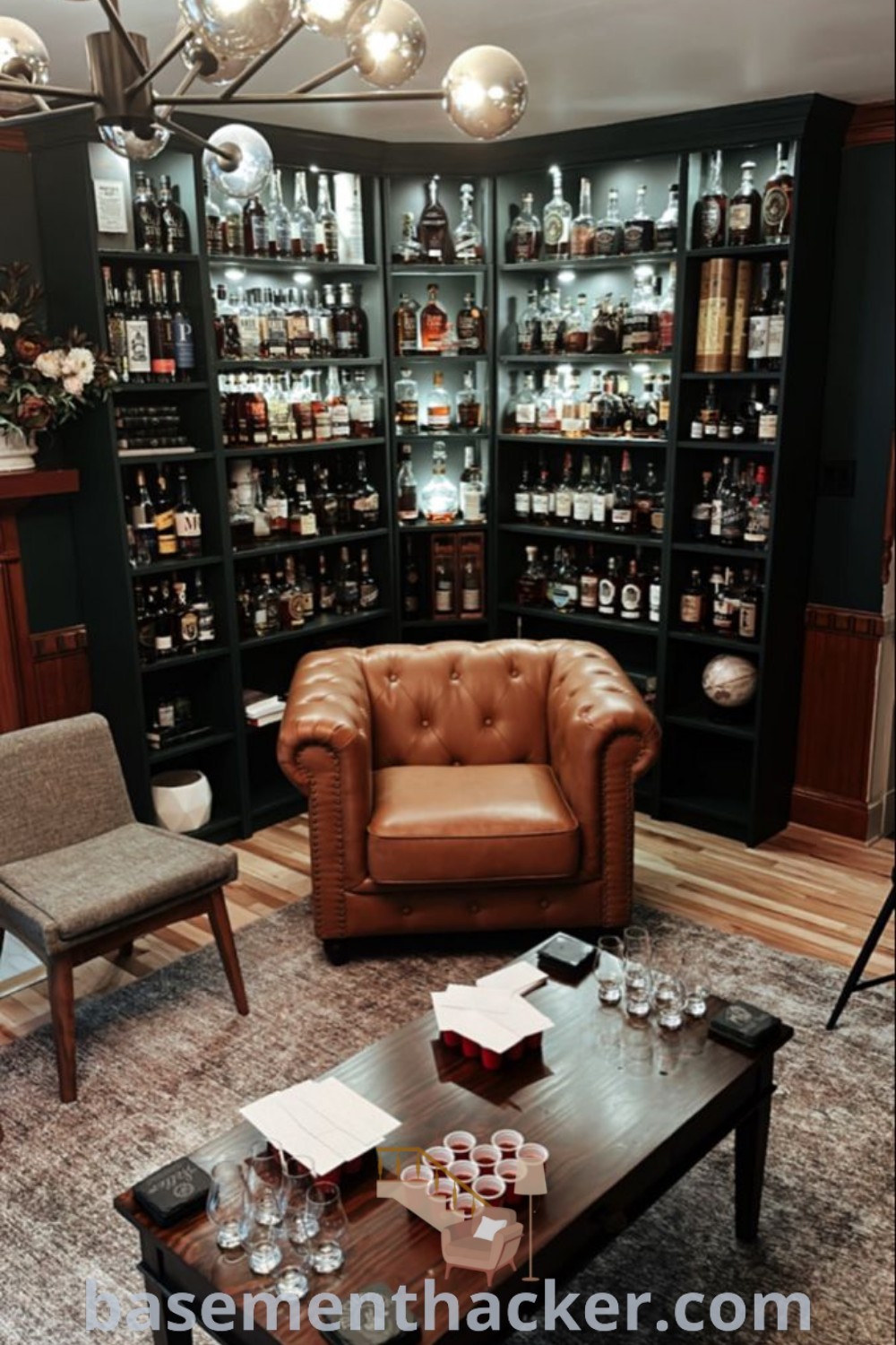 A stylish whiskey room featuring a bourbon display cabinet, showcasing a collection of bourbons and creating an inviting atmosphere for ultimate entertaining. This design emphasizes innovative ideas for a cozy and organized home, perfect for whiskey lovers. Find more inspirations for bourbon home decor at basementhacker.com.