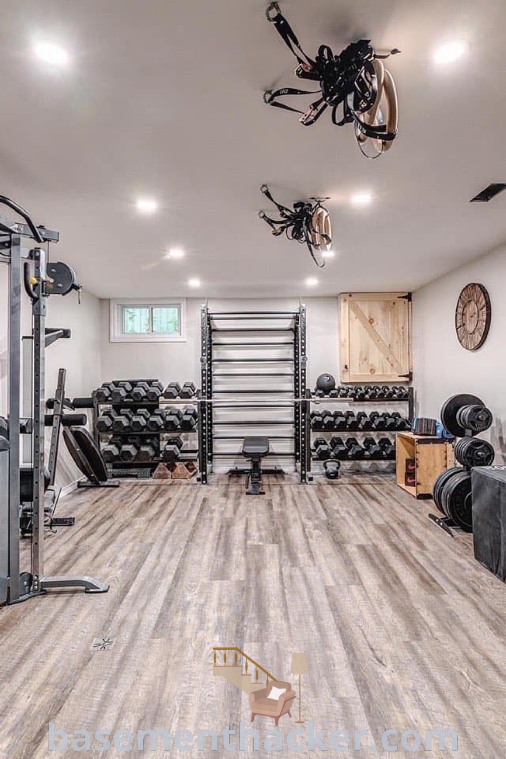A modern home gym with mirrors and fitness equipment, showcasing innovative ideas for designing stylish basement workout rooms. This space emphasizes functionality and aesthetics, ideal for small home gyms. Explore more about home gym building at basementhacker.com.