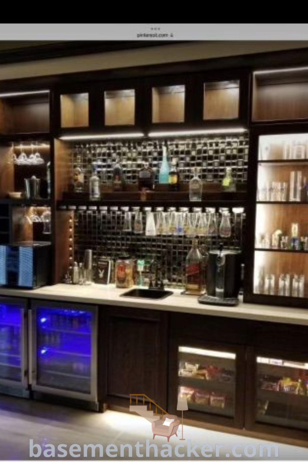 A modern home sports bar featuring a central bar setup with shelves lined with bottles, offering innovative design ideas for creating a stylish and functional space for ultimate entertaining. Explore more designs for rustic basement bars and freestanding units on basementhacker.com.
