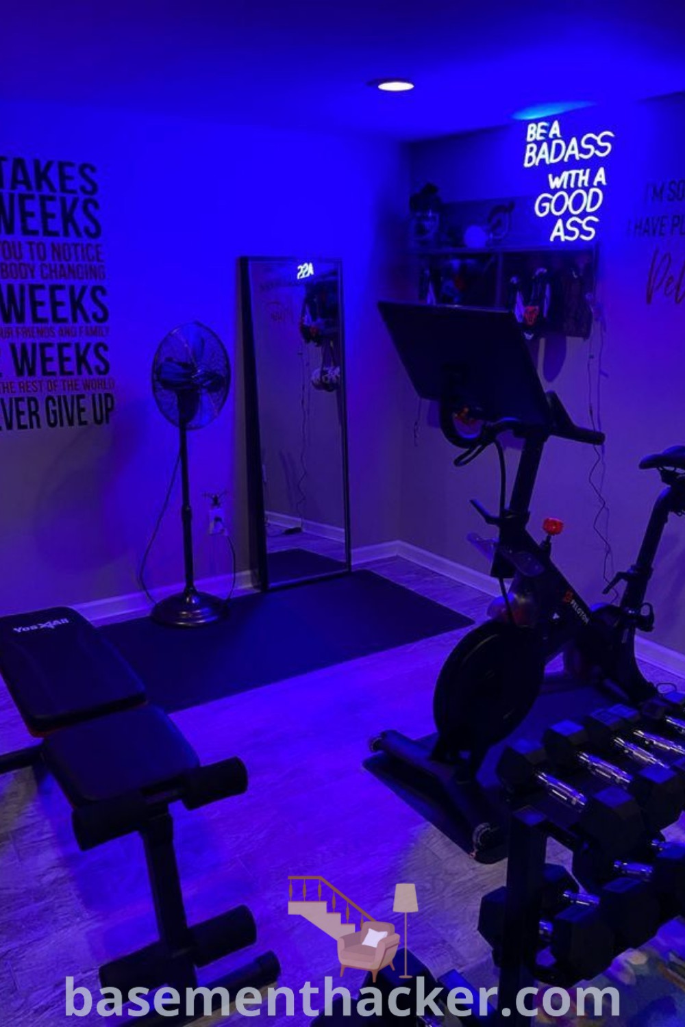An exercise room with purple lighting showcasing an innovative Peloton gym setup, ideal for mini gym ideas at home. This stylish bonus space provides both aesthetic appeal and functional design, featured on basementhacker.com, offering insights for enhancing your home gym experience.