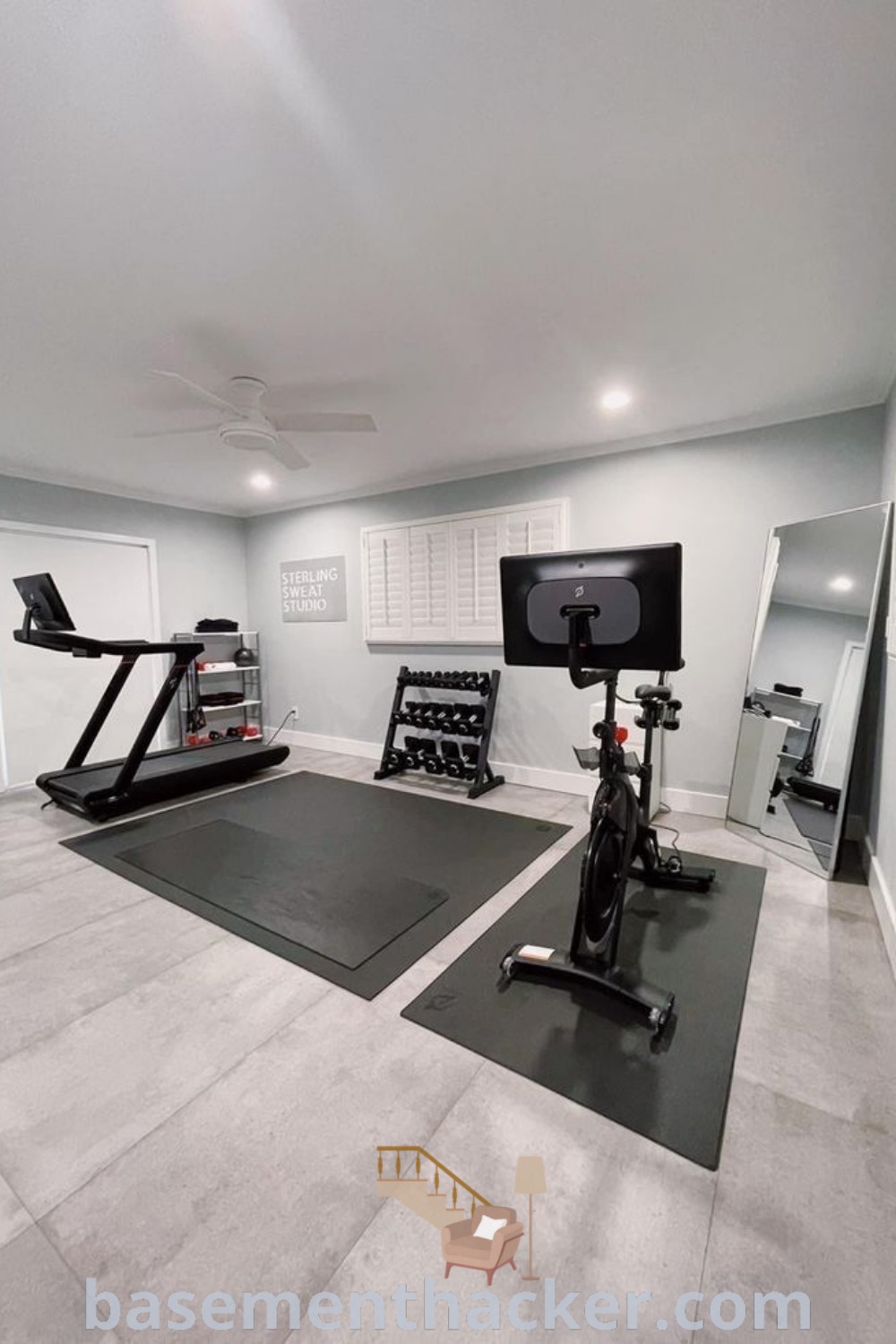 A home gym with treadmills and exercise equipment, showcasing innovative ideas for designing a basement workout room. This space offers stylish bonus room design ideas perfect for family fitness, enhancing your home with awesome functionality and decor. Discover more at basementhacker.com.