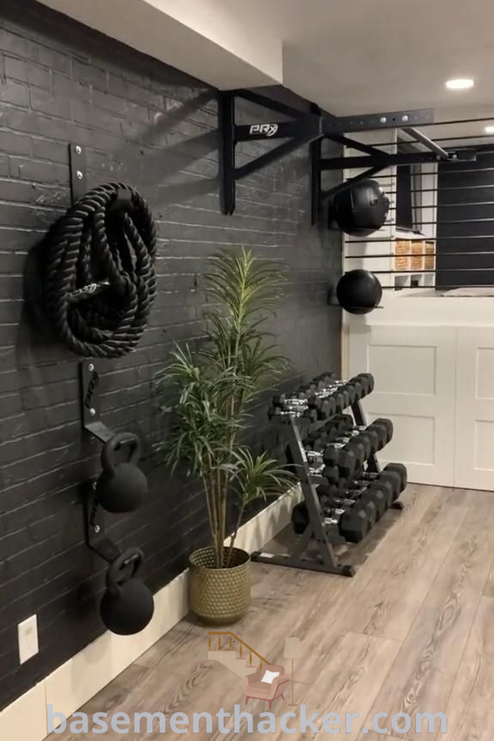 A vibrant mini gym in a basement featuring an accent wall, designed for ultimate functionality and style. This innovative home gym space showcases ideas for a stylish and organized environment, perfect for all fitness enthusiasts. Discover more innovative basement makeover ideas for your home at basementhacker.com.