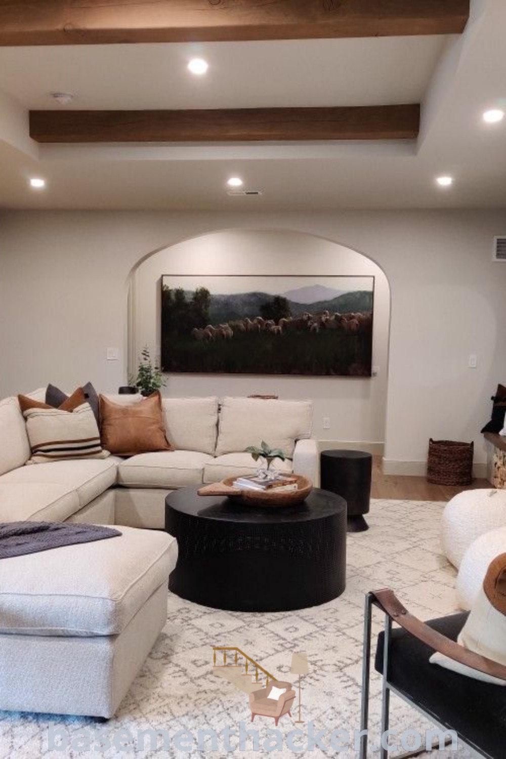 A cozy modern basement living room filled with comfortable furniture and a central fireplace, showcasing innovative ideas for a stylish and functional home design. This inviting space is perfect for families, providing the best basement remodeling ideas and cozy atmosphere for ultimate entertaining. Explore more at basementhacker.com.