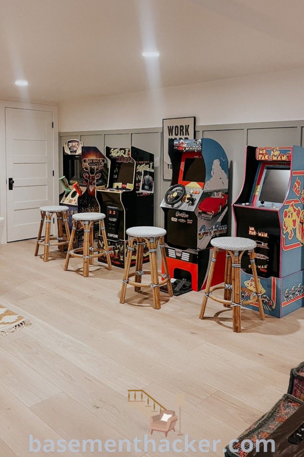 A lively basement arcade featuring several arcade machines and stools, creating an ultimate entertaining space for gaming. This innovative basement makeover is designed for a stylish bonus room that the whole family will enjoy. Find more ideas and inspirations at basementhacker.com.