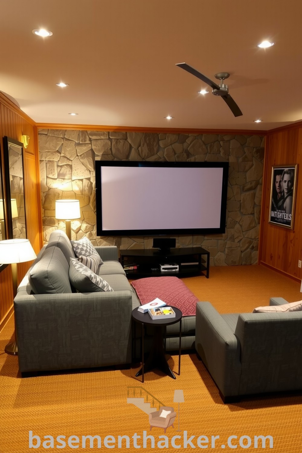 Inviting basement theater with an overstuffed gray couch, a snack table, ambient lighting, and framed film posters, perfect for ultimate entertaining and showcasing innovative basement makeover ideas for a stunning revamp on basementhacker.com.