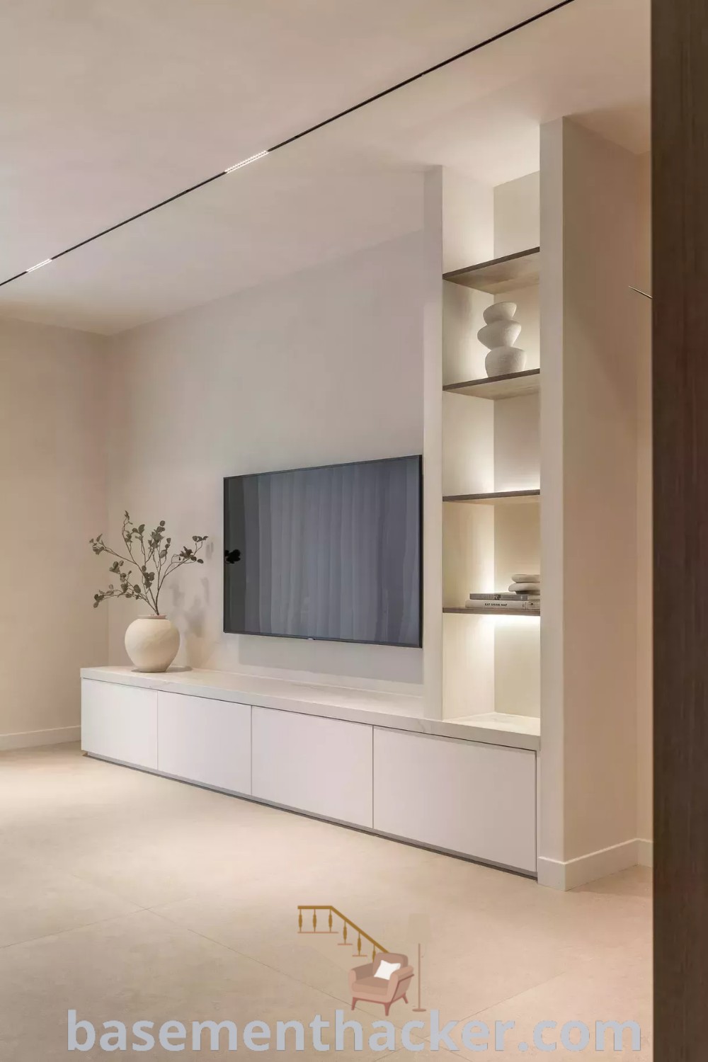 A stylish living room with a large flat-screen TV on a white entertainment center, showcasing modern apartment living room design. This space offers innovative ideas for creating a cozy, functional home design, perfect for family entertaining. More inspiration can be found at basementhacker.com.