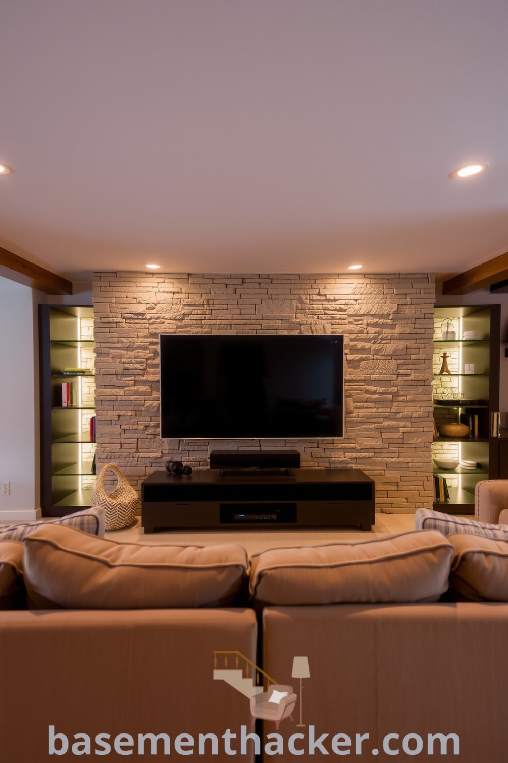Stylish basement living room featuring a plush sofa, textured stone wall, wooden ceiling beams, ambient lighting, and built-in shelving for a cozy and organized home design, showcased on basementhacker.com.