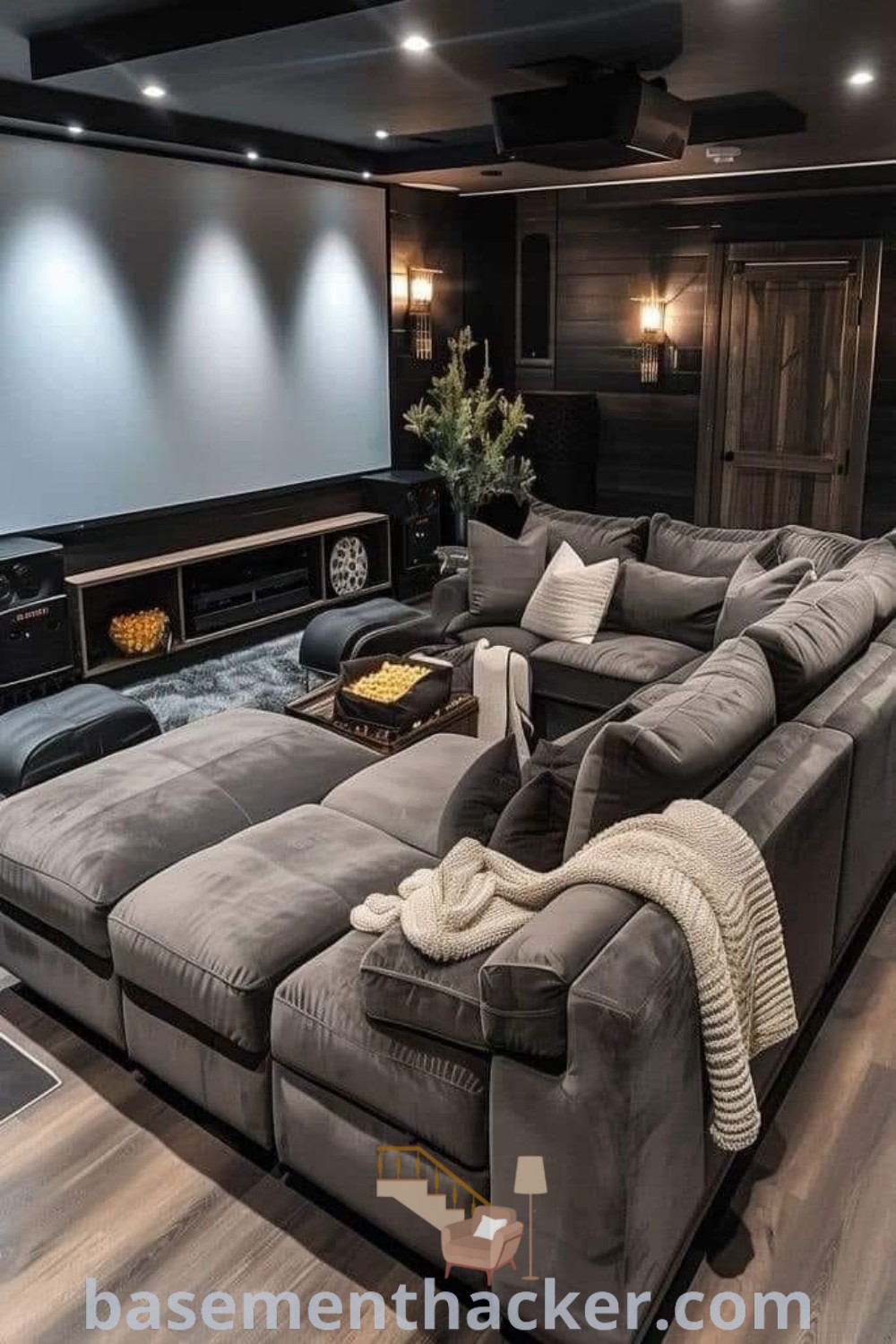 A stylish living room featuring couches, a flat-screen TV, and innovative decor ideas for a home theater room design. This space is ideal for both cozy family movie nights and ultimate entertaining, showcasing the best basement remodeling ideas for your home. Discover more design inspirations at basementhacker.com.