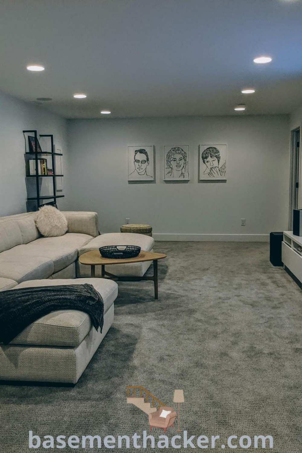 A cozy living room equipped with comfortable furniture and a flat-screen TV, showcasing innovative ideas for small space theater rooms, large media room ideas, and home theatre guest rooms. This atmosphere promotes ultimate entertaining and evokes a warm ambiance for family gatherings. Explore more design inspirations at basementhacker.com.