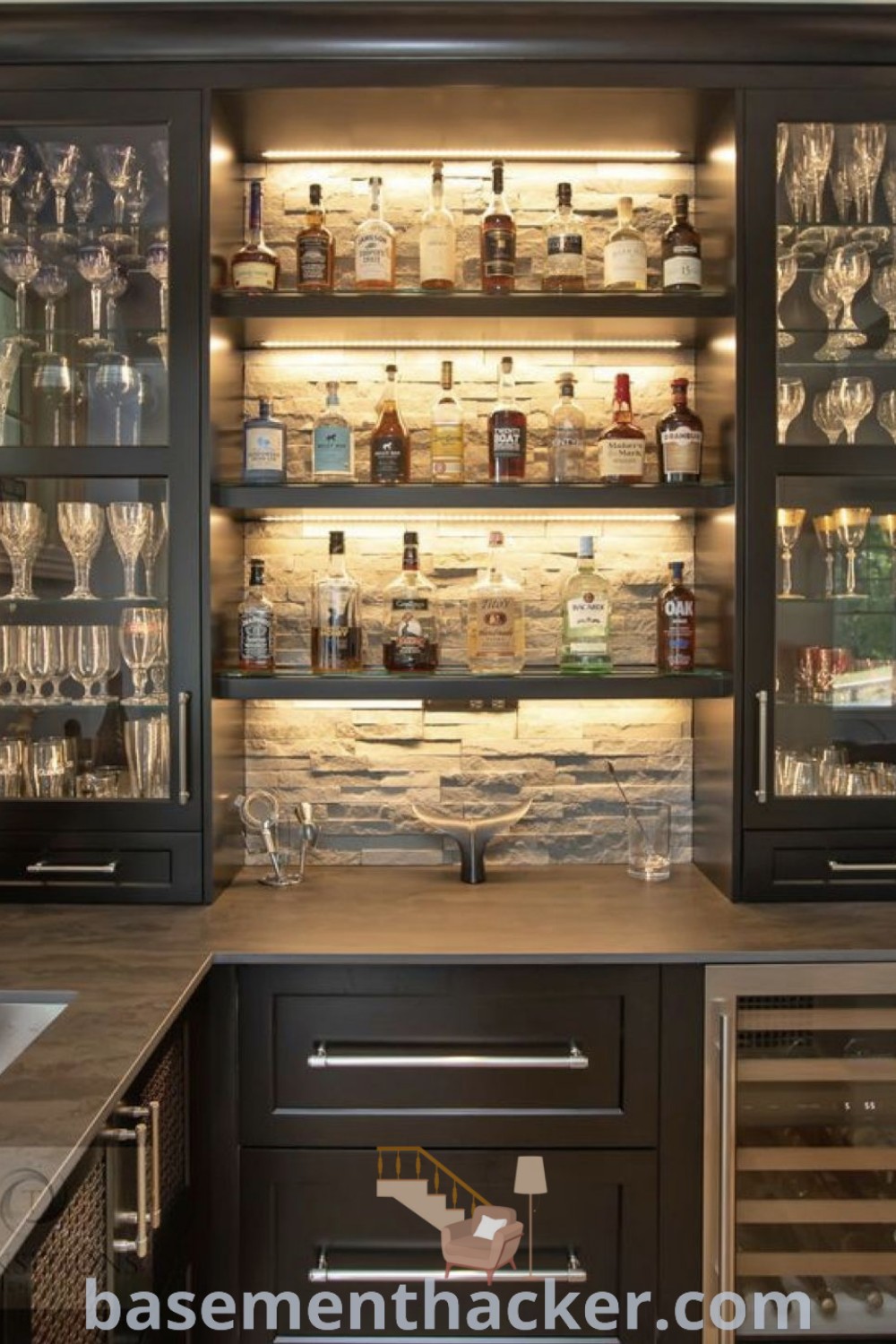 An industrial dry bar with wine glasses and liquor bottles, showcasing modern design ideas for a stylish and functional home. This space offers innovative basement makeover ideas for a stunning revamp, perfect for remodeling as a bar and wine area at basementhacker.com.