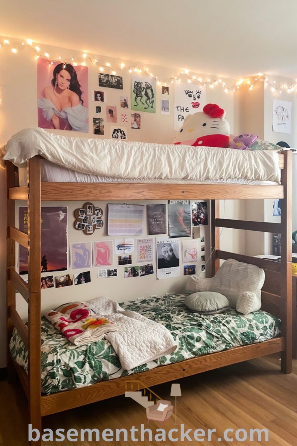 A cozy room featuring a stylish bunk bed with decorative lights and wall art, showcasing innovative ideas for designing dorm room bunk beds. The space highlights dorm room aesthetic elements and offers practical tips for hostel bed decoration, ideal for anyone looking to revamp their living area. Discover more at basementhacker.com.