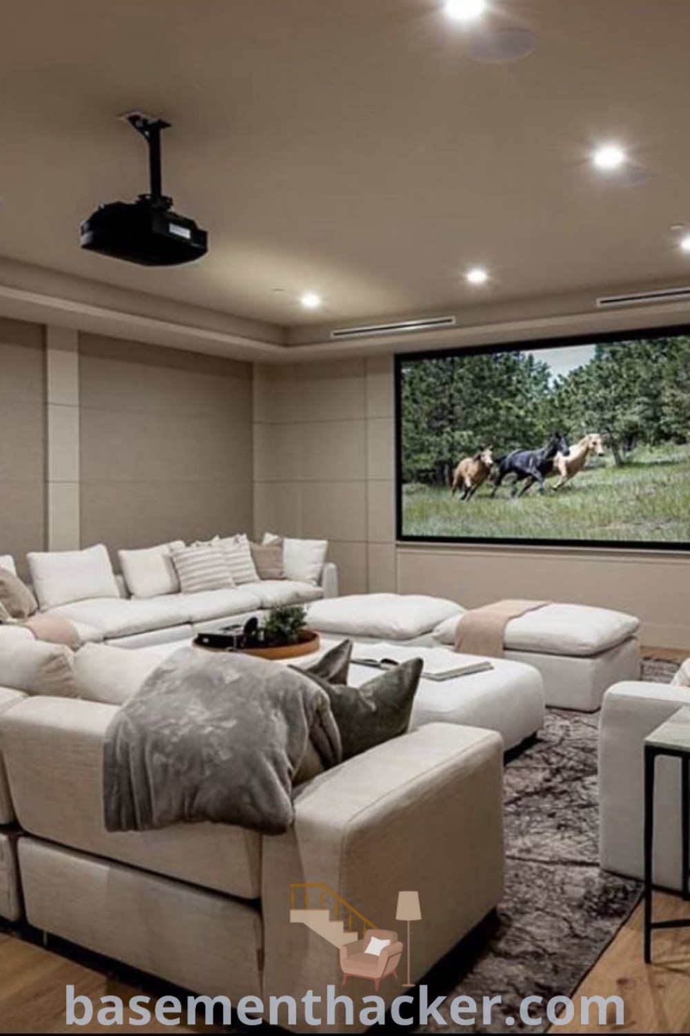 A stylish basement family room featuring a comfortable sofa, a flat-screen TV mounted on the wall, and decorative ideas for a cozy and organized home. Perfect for ultimate entertaining and movie nights, this space embodies innovative basement makeover ideas to elevate any family hangout room. Discover more at basementhacker.com.