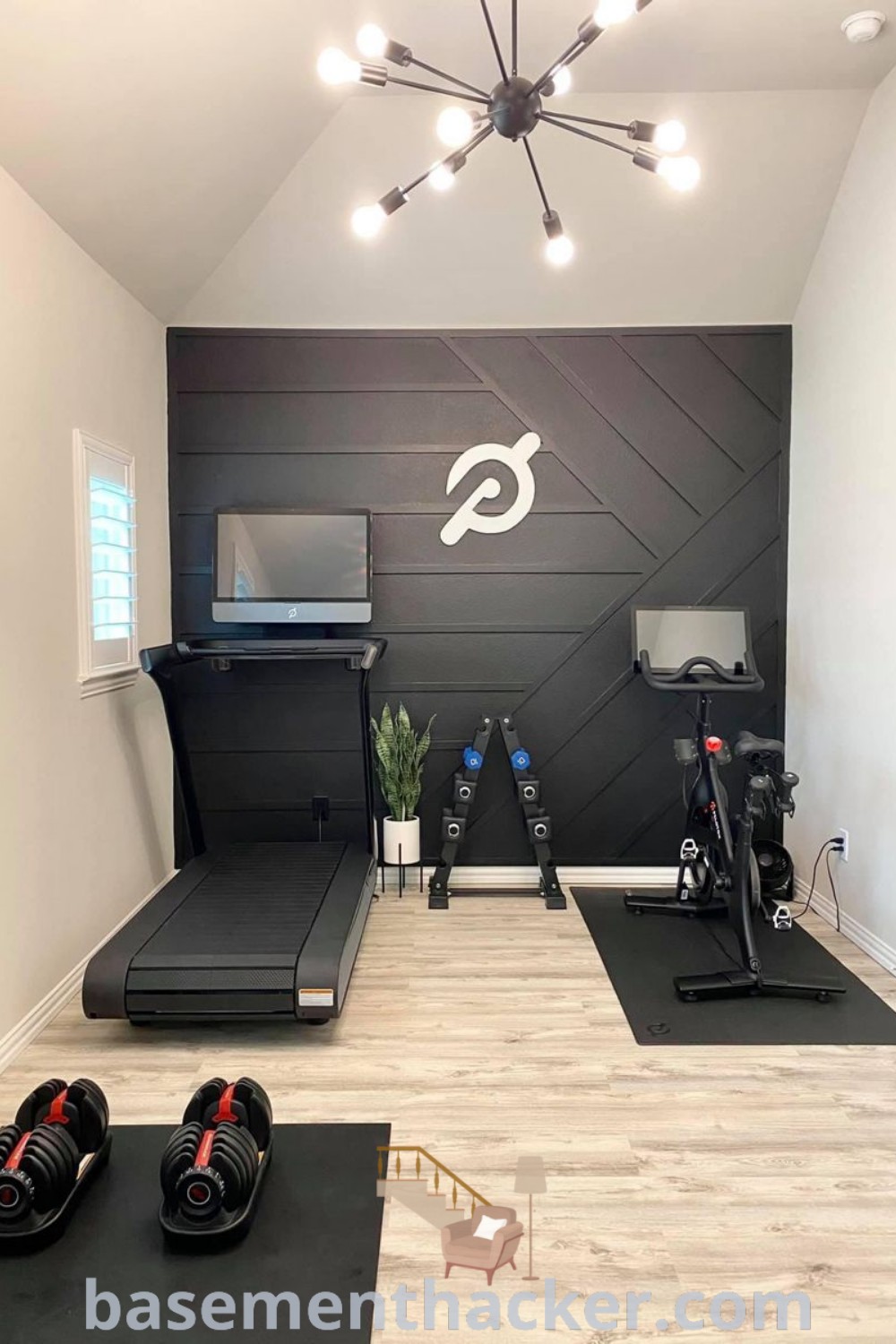 A home gym with exercise mats and treadmills designed for small spaces, showcasing innovative ideas for a basement gym corner. This mini fitness room emphasizes functionality and stylish decor, providing an inviting atmosphere for workouts. Explore more basementmakeover ideas at basementhacker.com.