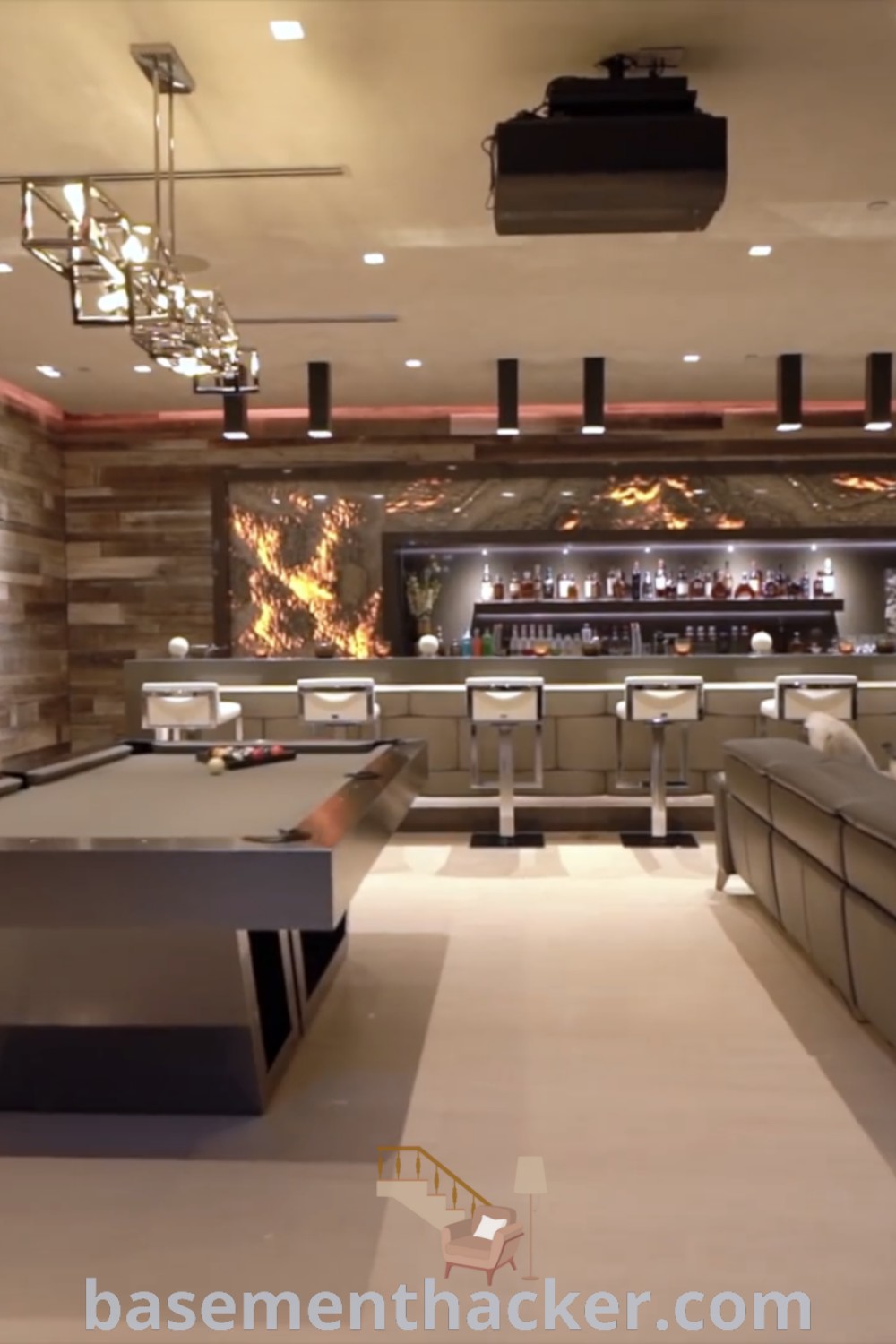 A large room with couches, tables, and a bar in the background, illuminated by lights, showcasing a stylish sport bar design ideal for a man cave or home theater. This space offers innovative basement makeover ideas for ultimate entertaining, making it perfect for those looking to enhance their homes—find more inspiration at basementhacker.com.