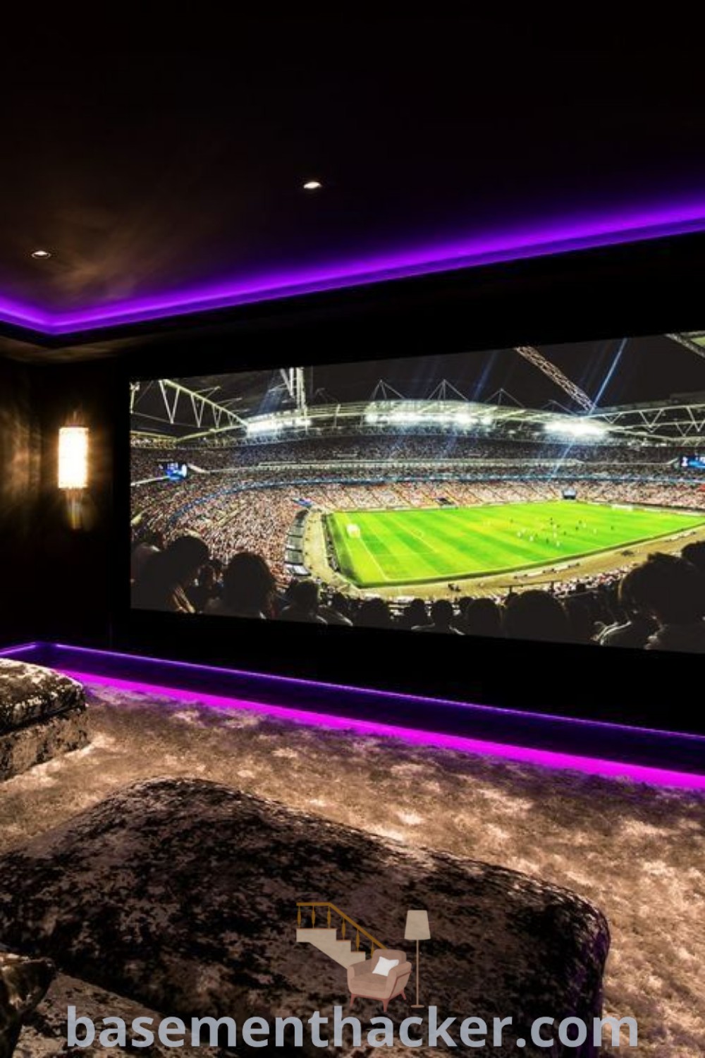 A spacious home theater corner with a large screen, two comfortable couches, and a stylish chair, designed for ultimate entertaining. This cinema room decor offers innovative ideas for a cozy and organized home, blending home theater aesthetic with functional design. Discover more inspiration at basementhacker.com.