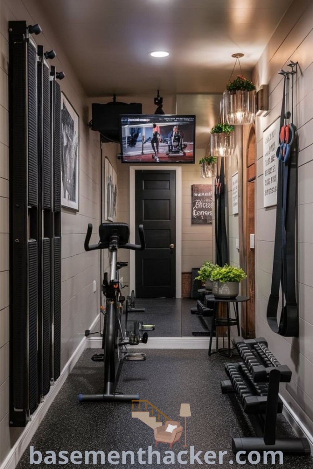 A compact home gym featuring treadmills, exercise bikes, and a flat screen TV on the wall, designed for small spaces. This innovative design offers stylish bonus room ideas for families and makes working out enjoyable. Explore more home gym aesthetic styles at basementhacker.com.