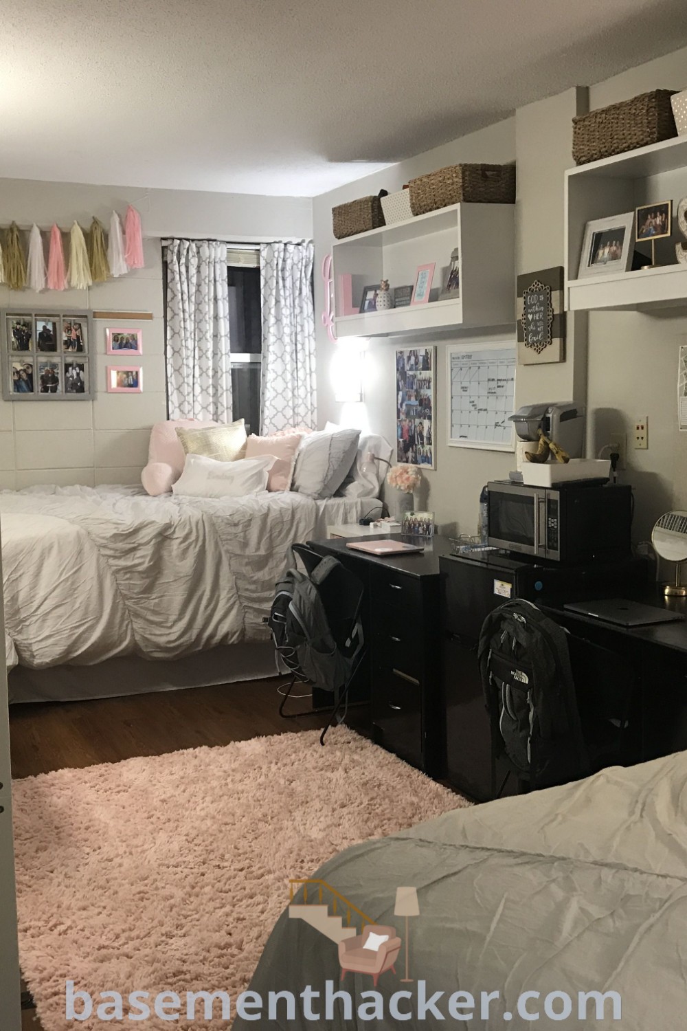 A clean and organized bedroom transformed into a study area with stylish decor. This versatile space reflects innovative ideas for designing dorm rooms and shared bedrooms, making it an ideal environment for productivity and relaxation. Explore more design inspiration at basementhacker.com.