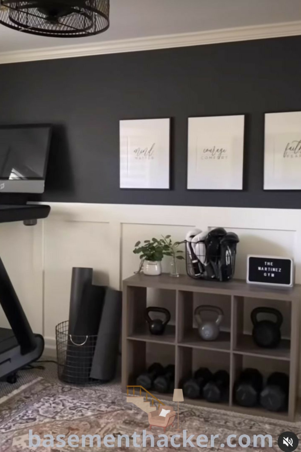 A home gym featuring a treadmill in a well-decorated room with inspirational pictures on the wall, showcasing innovative ideas for designing a functional and stylish fitness space. Ideal for workout routines and creating a motivating atmosphere, find more gym setup inspirations at basementhacker.com.