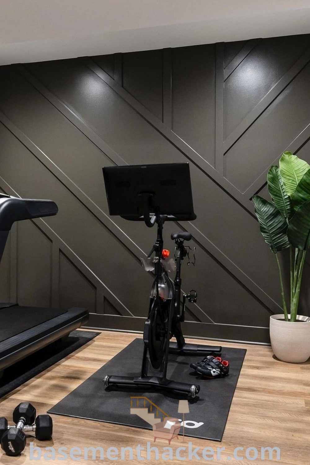A basement workout room featuring a bike and various exercise equipment, showcasing stylish and functional design ideas for a home gym. This space blends aesthetics with utility, ideal for family fitness and relaxation. Discover more suggestions at basementhacker.com.