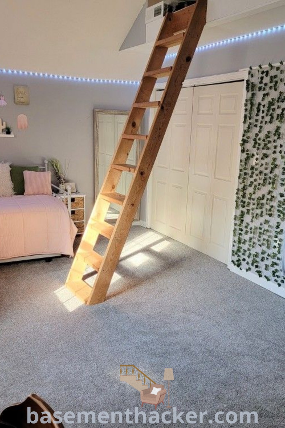 A stylish teen bedroom showcasing a cozy bed, desk, and decorative ladder with a wall covered in lush green leaves, featuring sage green and pink decor. Discover innovative ideas for designing your space at basementhacker.com.