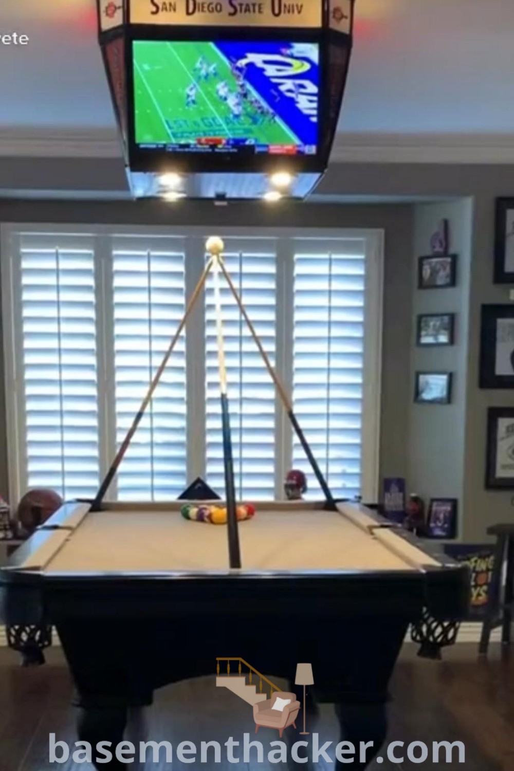 A stylish game room featuring innovative design ideas with a pool table and decor that showcases man cave ideas, adult game room concepts, and home arcade room inspirations. Perfect for ultimate entertaining, this space highlights creative decor solutions from basementhacker.com, offering various game room ideas for a cozy and organized atmosphere.