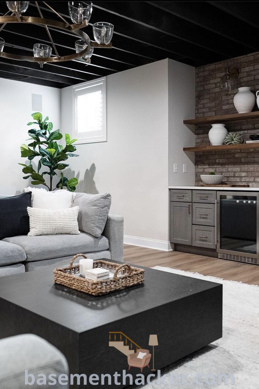 A stylish basement bedroom featuring black paint colors and innovative decor ideas for maximizing space. This room is designed for ultimate functionality and comfort, showcasing the best basement remodeling ideas for a cozy and organized home. Discover more basement design inspirations at basementhacker.com.