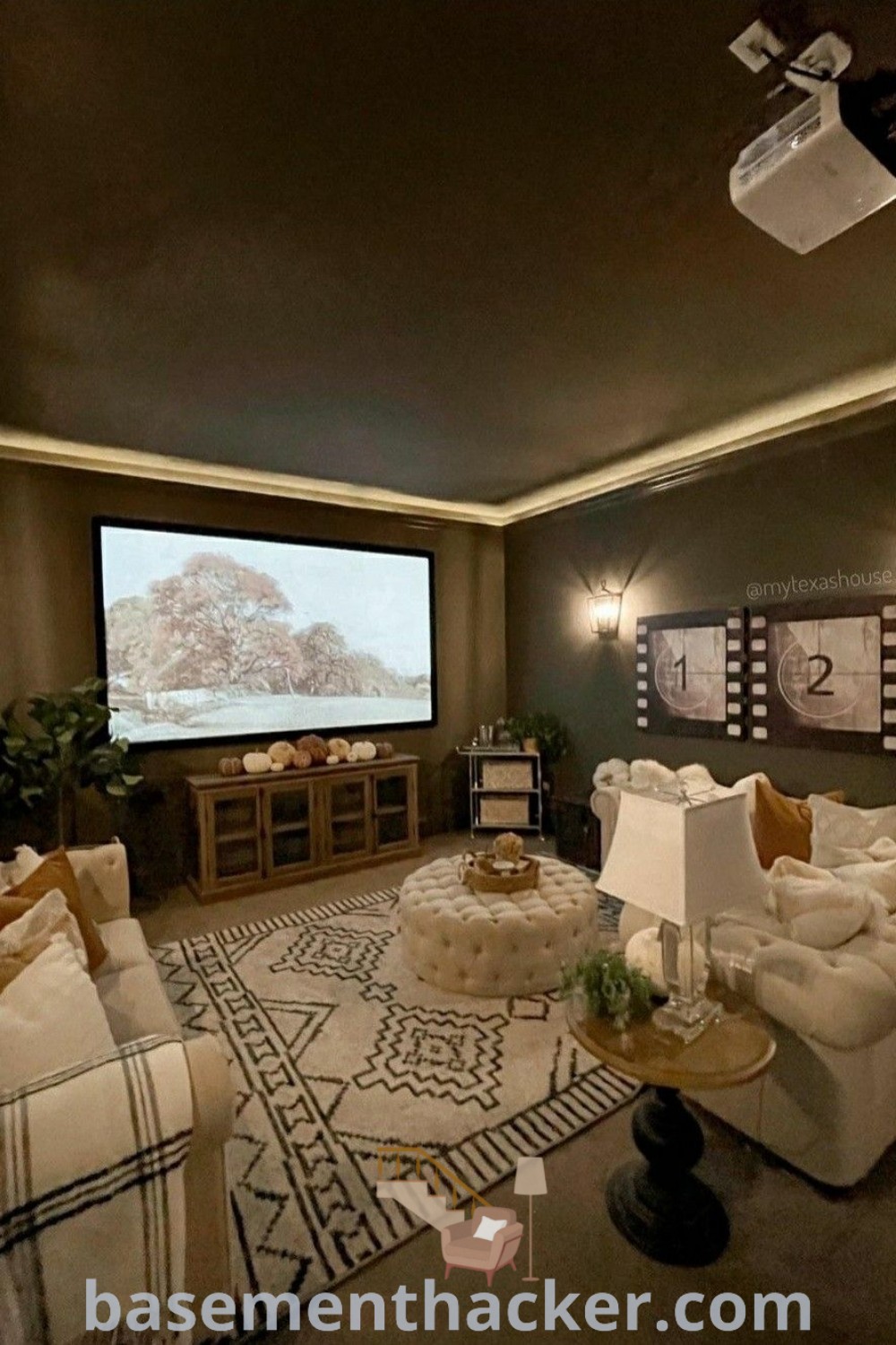 A stylish basement lounge filled with contemporary furniture, featuring a flat-screen TV mounted on the wall for an ultimate entertaining experience. This design showcases innovative ideas for basement remodels, offering the best basement remodeling ideas for a cozy and functional family space. Find more inspiration at basementhacker.com.