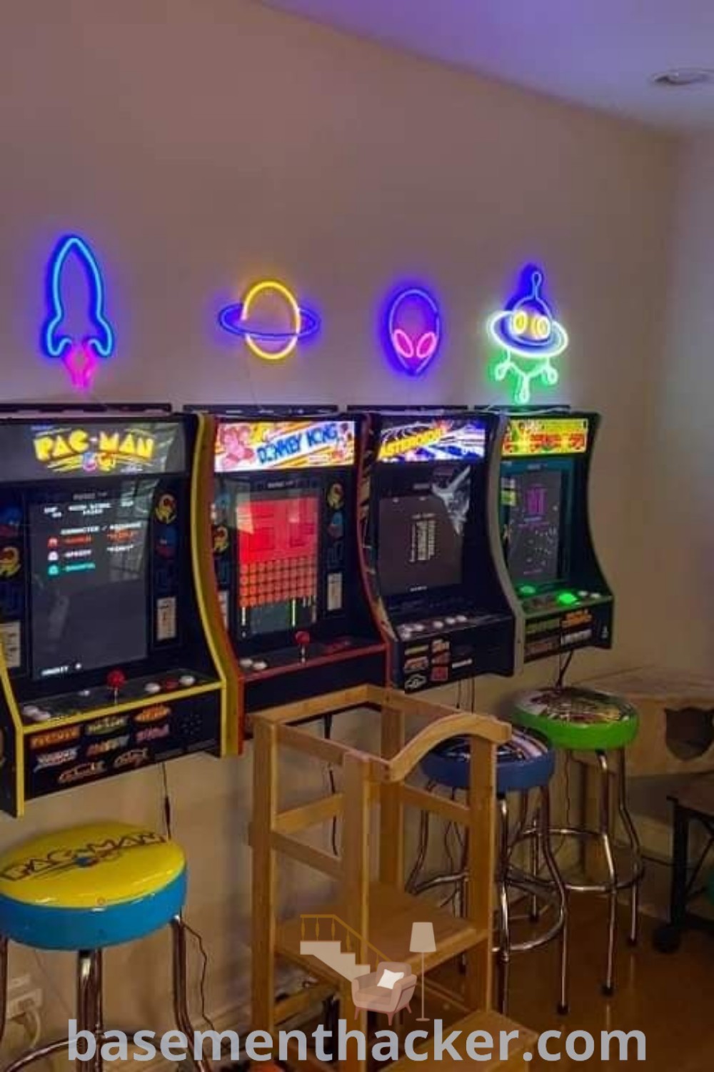 A lively home video game room with two children playing together, surrounded by neon lights and stylish stools, showcasing innovative ideas for a cozy and functional space. Find more gaming room inspiration at basementhacker.com.