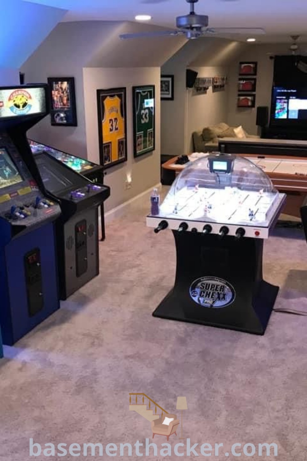A stylish arcade game room featuring several arcade machines, perfect for a cozy basement video game area. This innovative design offers ideas for creating the ultimate entertaining space, ideal for family gatherings. Explore more at basementhacker.com.